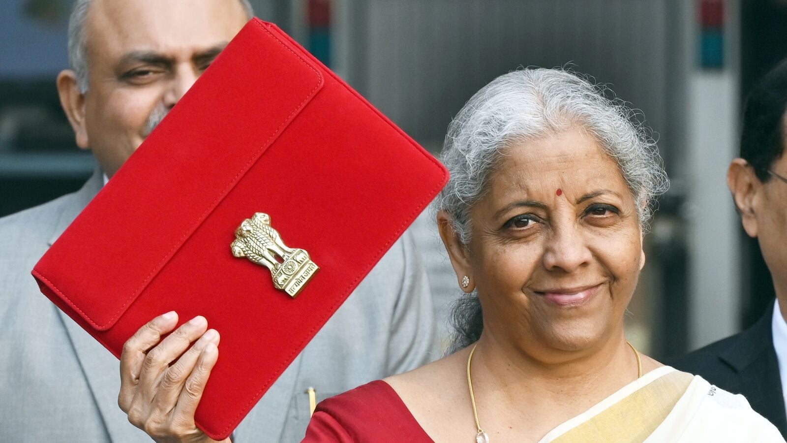 Union Finance Minister Nirmala Sitharaman with other officials outside the Finance Ministry ahead of the Budget 2025 presentation